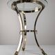 Neoclassical side table in brass and bevelled glass with ram's heads, 1970s.