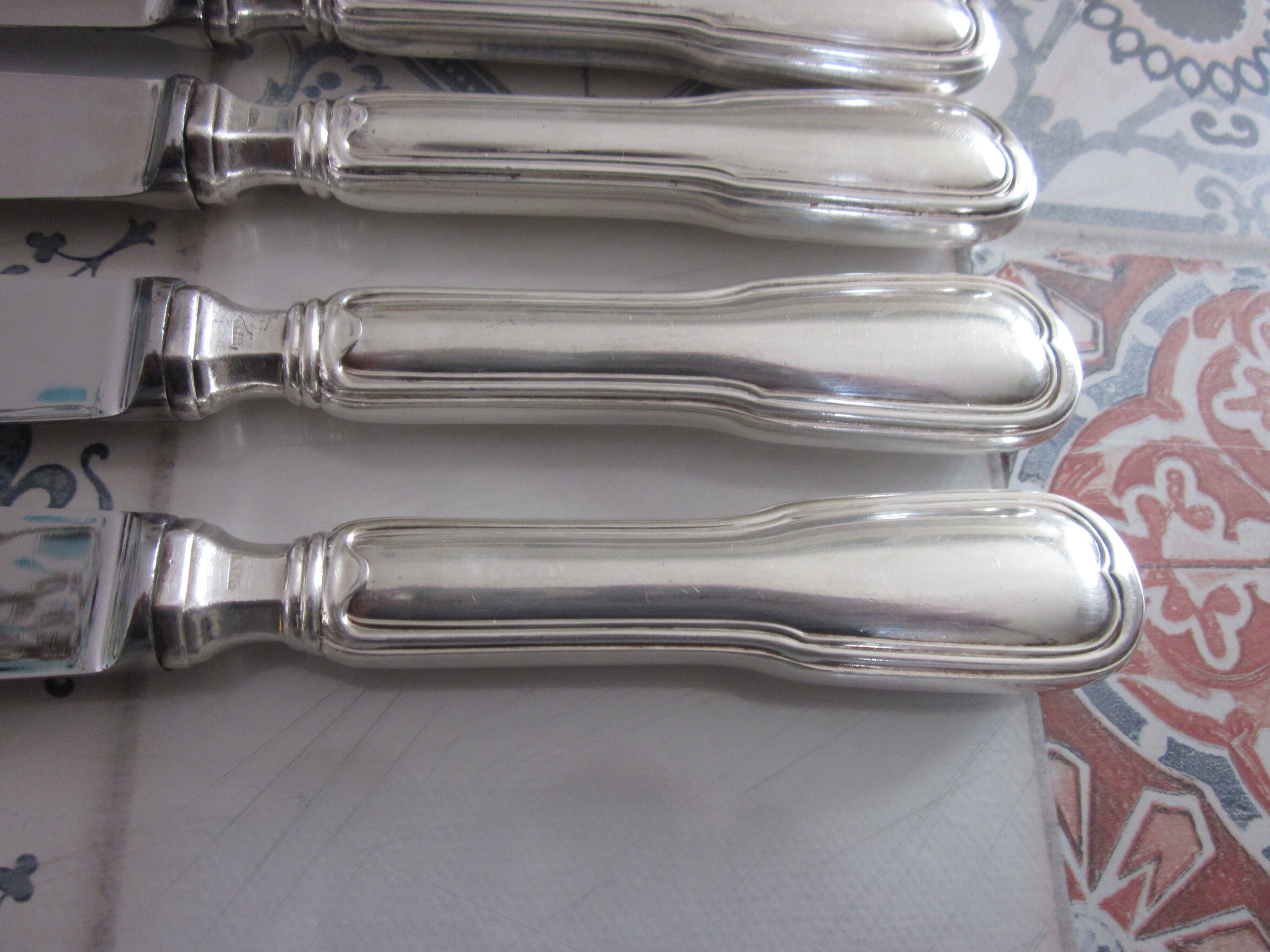 12 silver metal knives