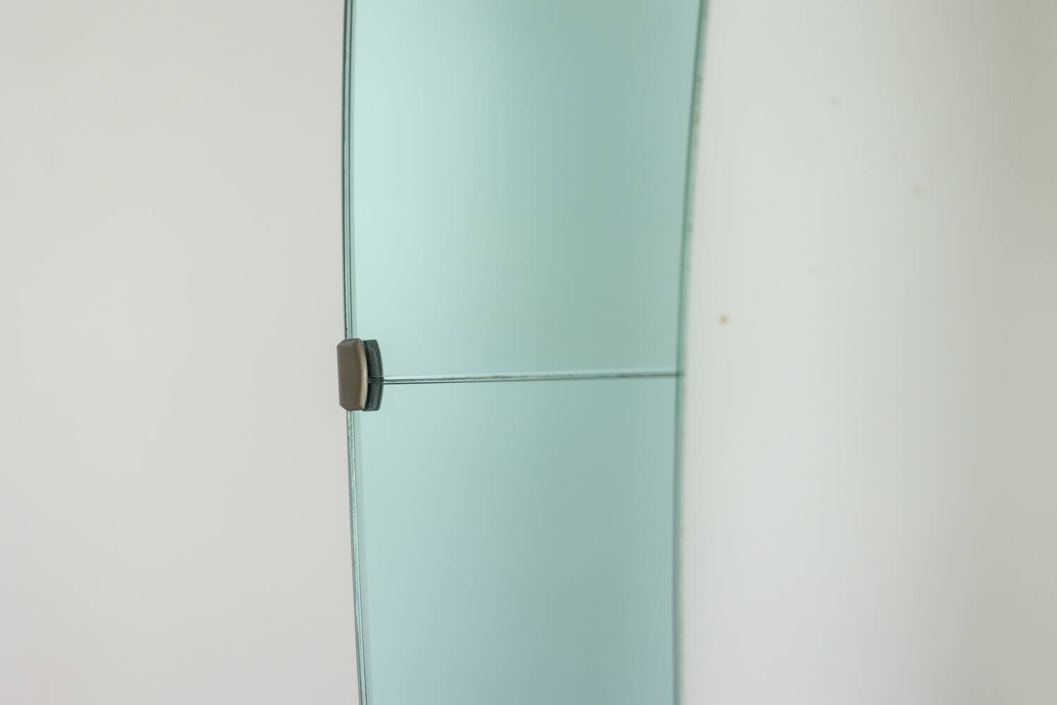 Two-tone glass console mirror with gilded brass. Circa 1950.