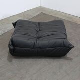 Togo armchair and footrest in black leather by Ligne Roset, designed by Michel Ducaroy.