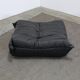 Togo armchair and footrest in black leather by Ligne Roset, designed by Michel Ducaroy.