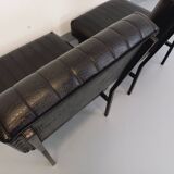 Set of 2 vintage modernist armchairs in black faux leather and metal.