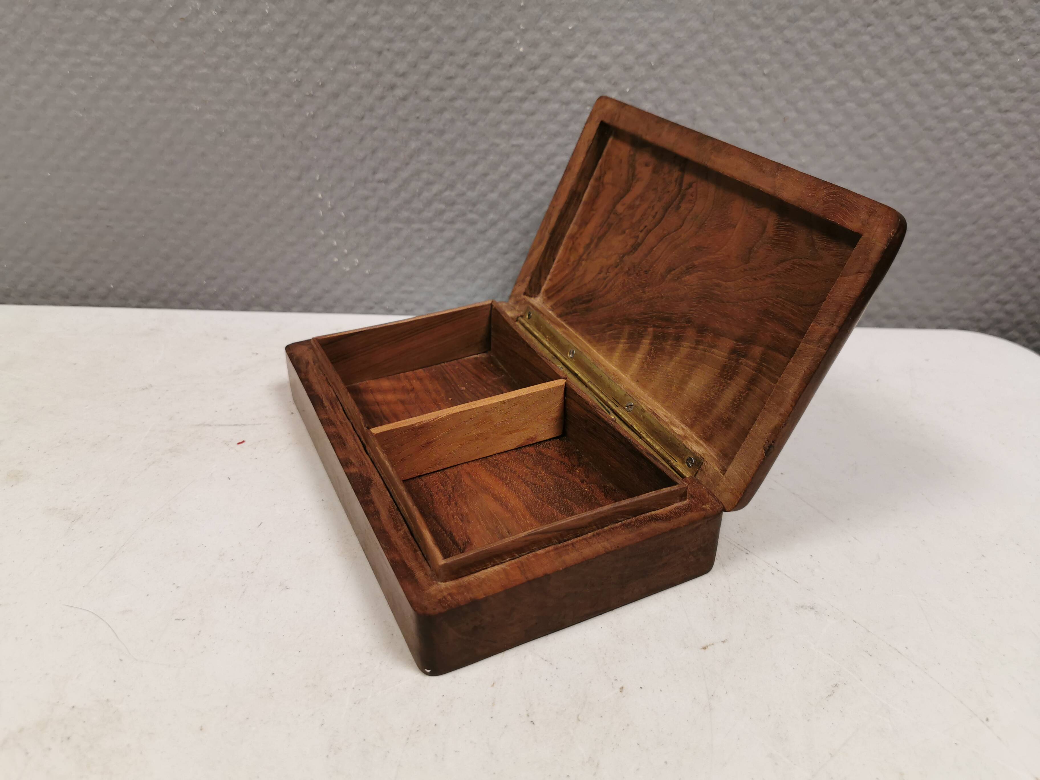 Wooden trinket box for storing jewellery, cigarettes or similar items.
