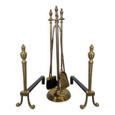 Pair of fire dogs and fireplace tools