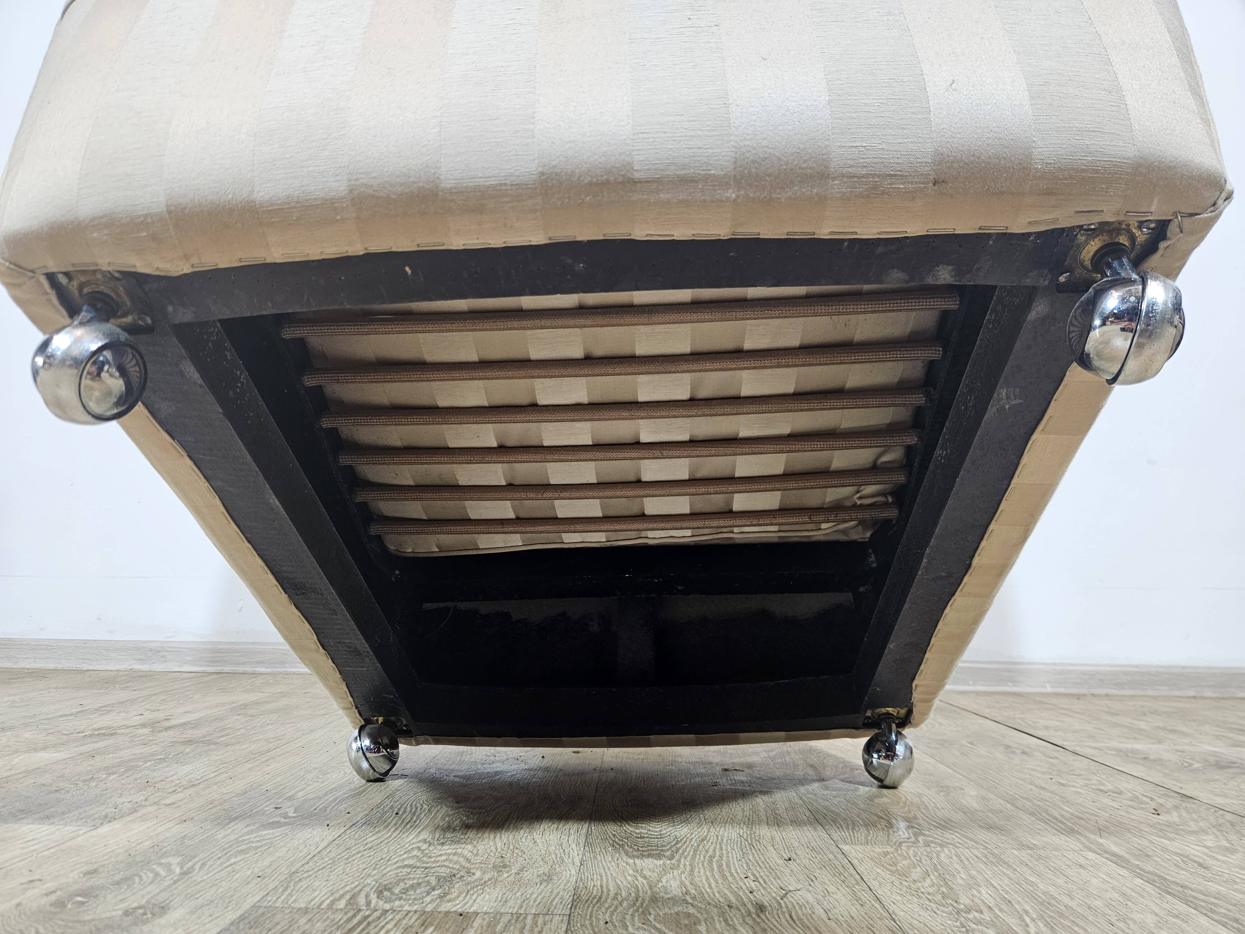 Winged armchair with footstool, 1960s.