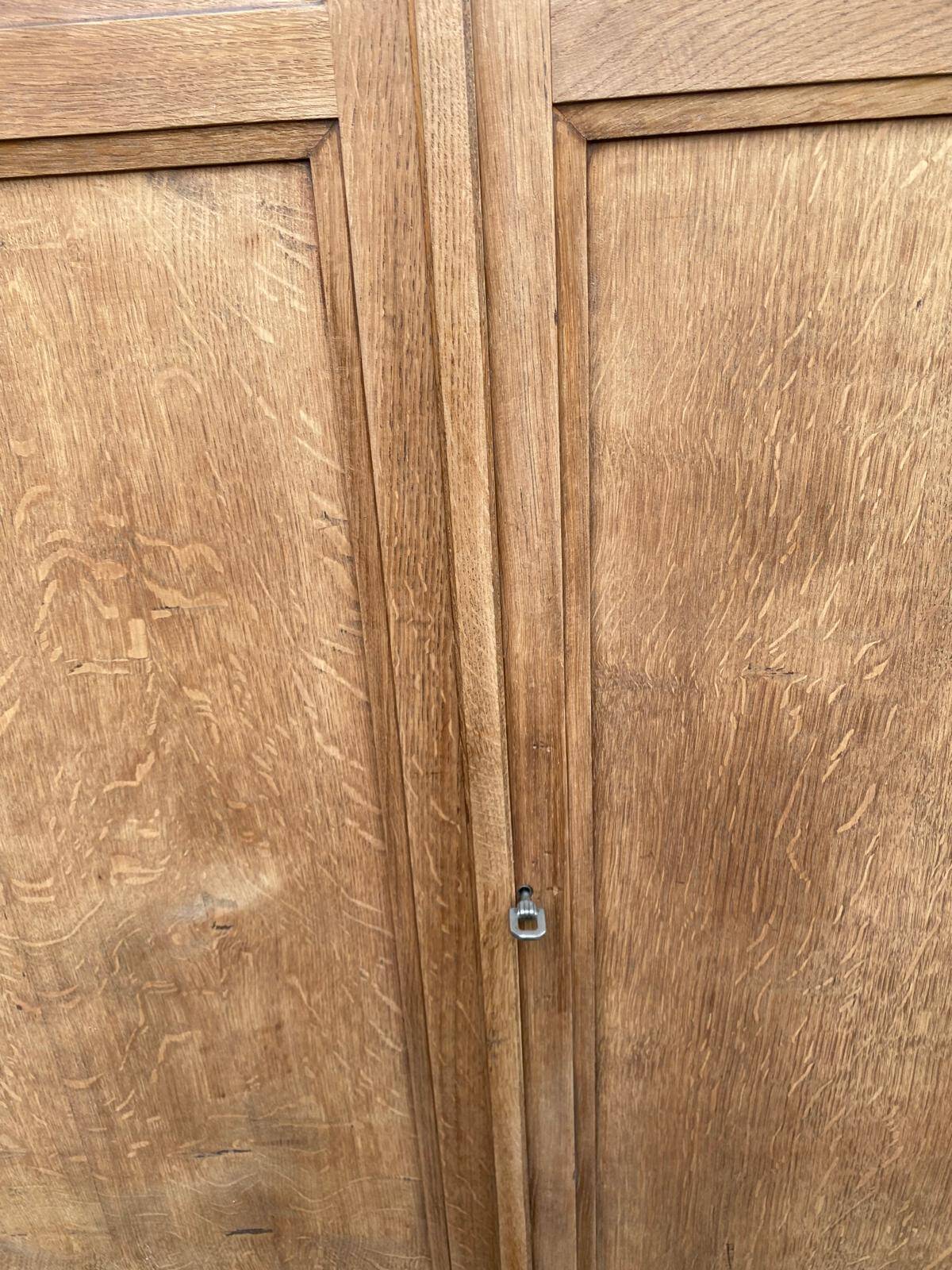 Parisian bonnetière cabinet, stripped display in solid oak from the 1930s.