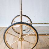 Serving table in gilded metal and glass with large wheels 1950