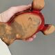 Beautiful seal in ceramic with metallic red glaze.