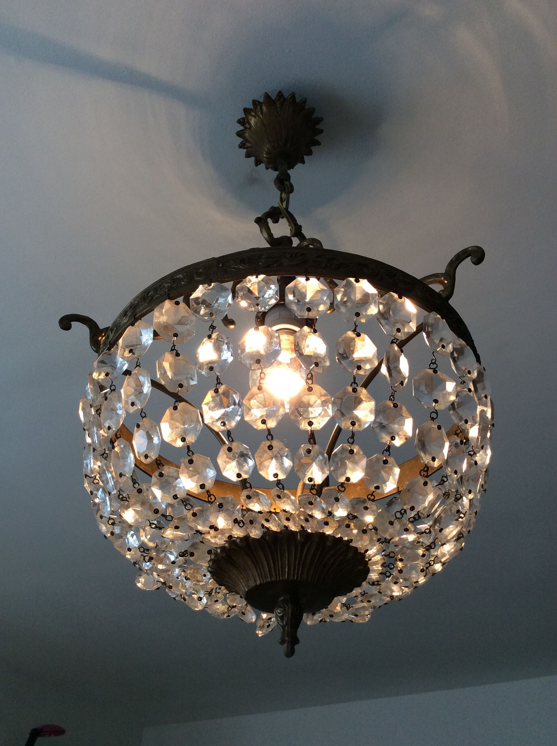 Old chandelier with bronze stamps