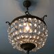 Old chandelier with bronze stamps