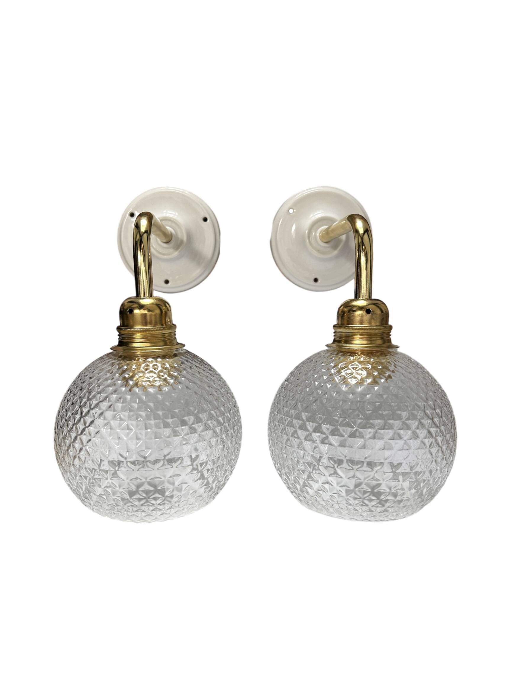Pair of chiseled glass wall sconces