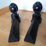 Cast iron andirons with character heads