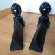 Cast iron andirons with character heads