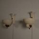 Pair of sculptural mid-century wall uplighters, circa 1950