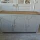 Vintage low sideboard with 3 doors, pearl gray patina, wooden top.