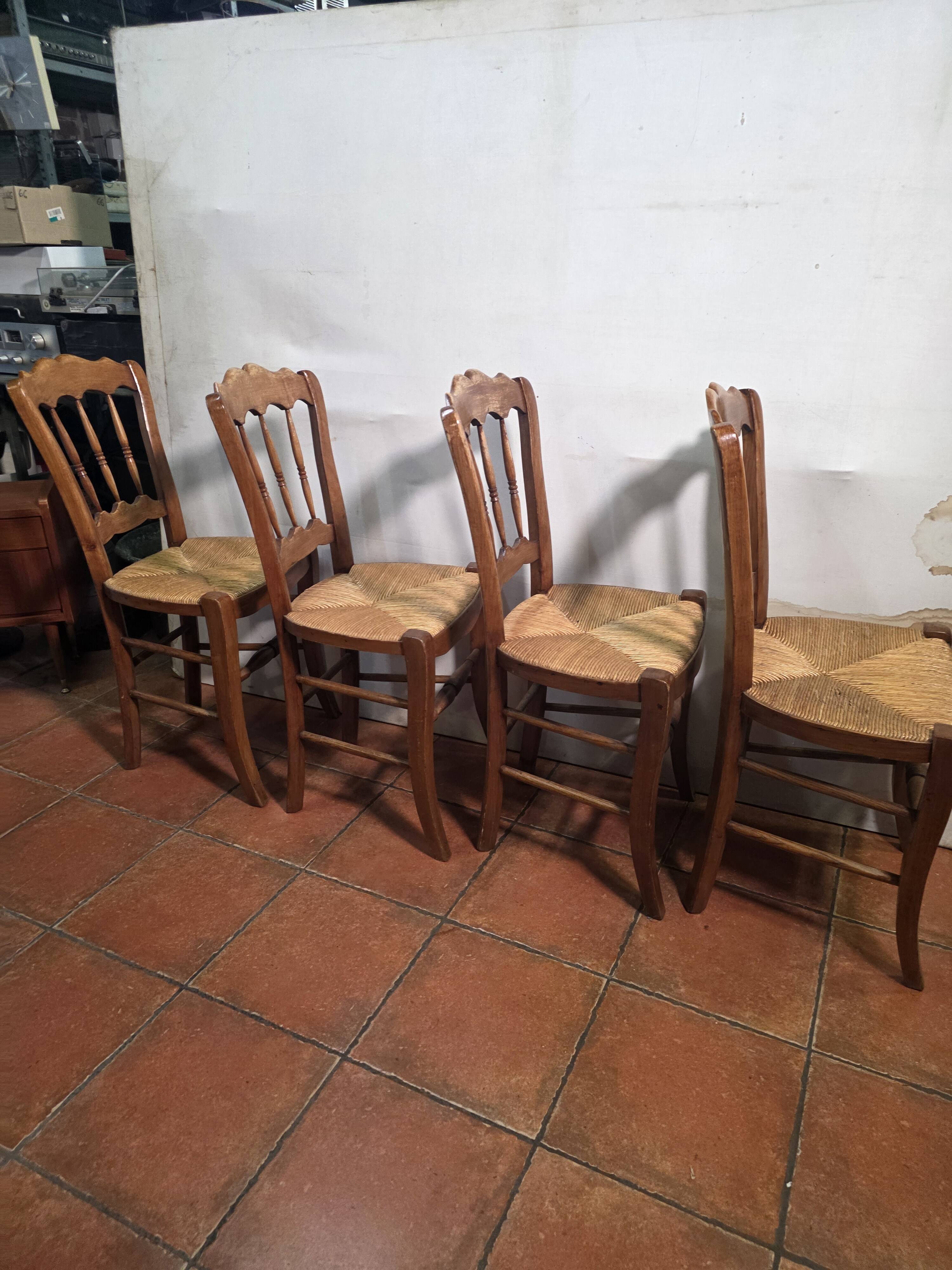 4 rustic farmhouse chairs made of wood and straw