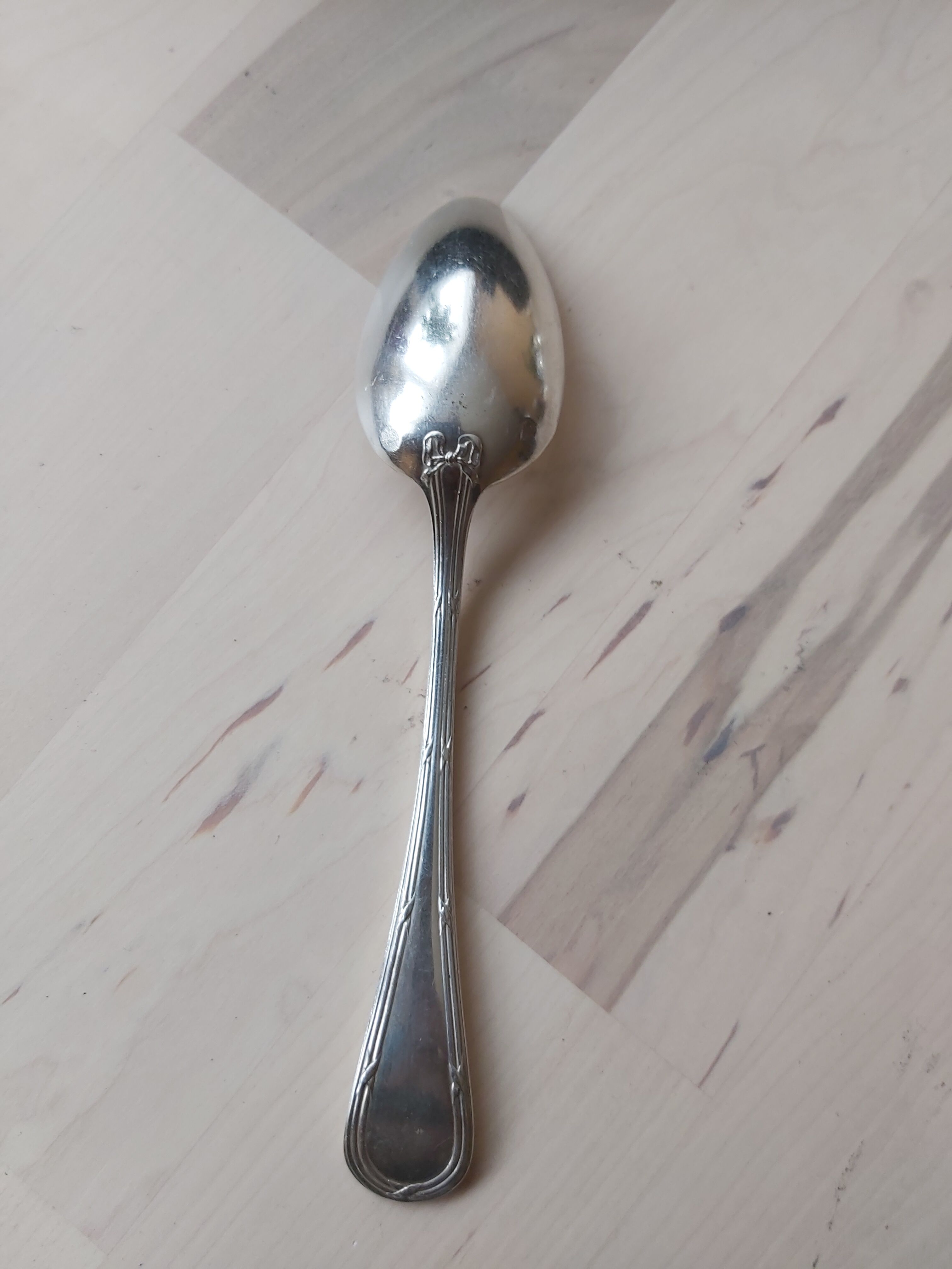 Series of 11 small silver metal spoons