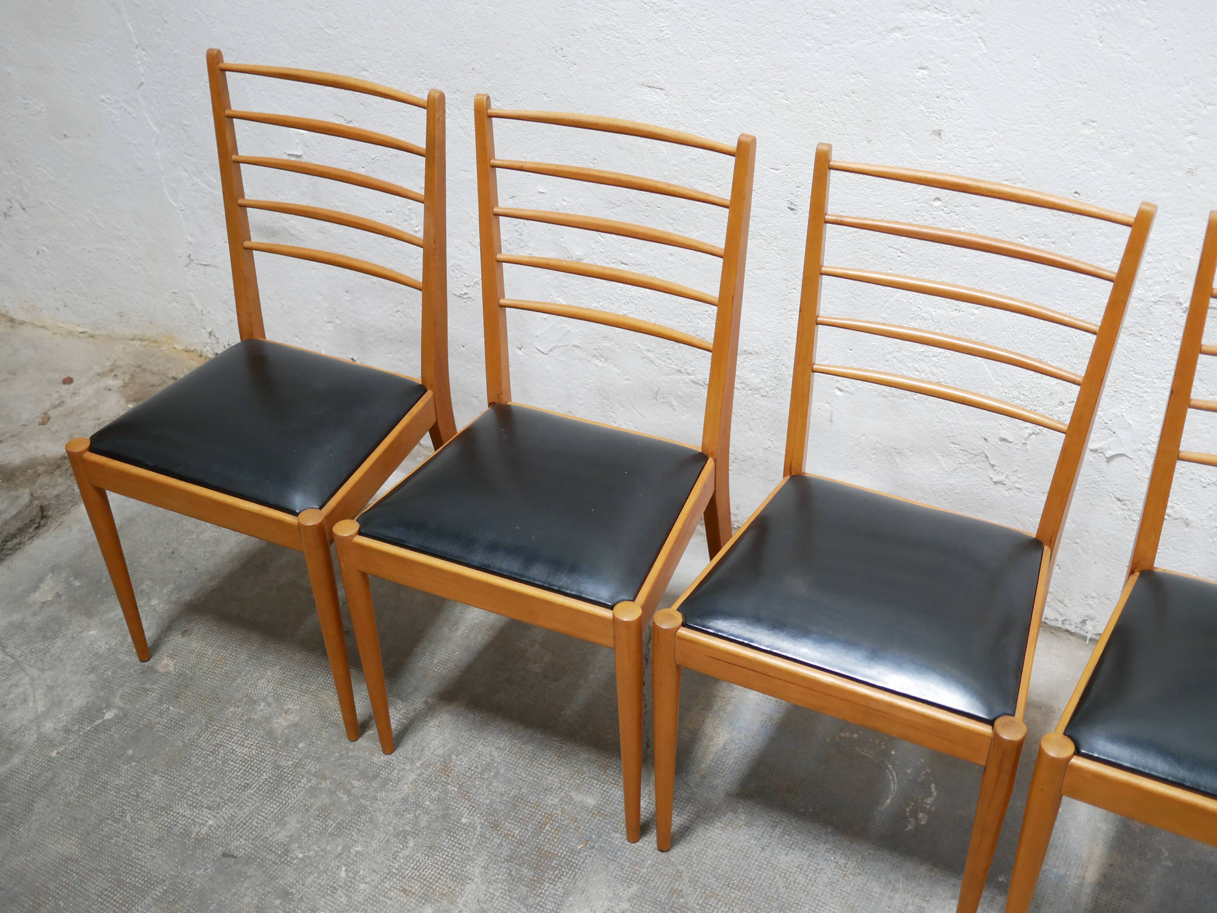 Series of 4 vintage chairs in wood and skaï