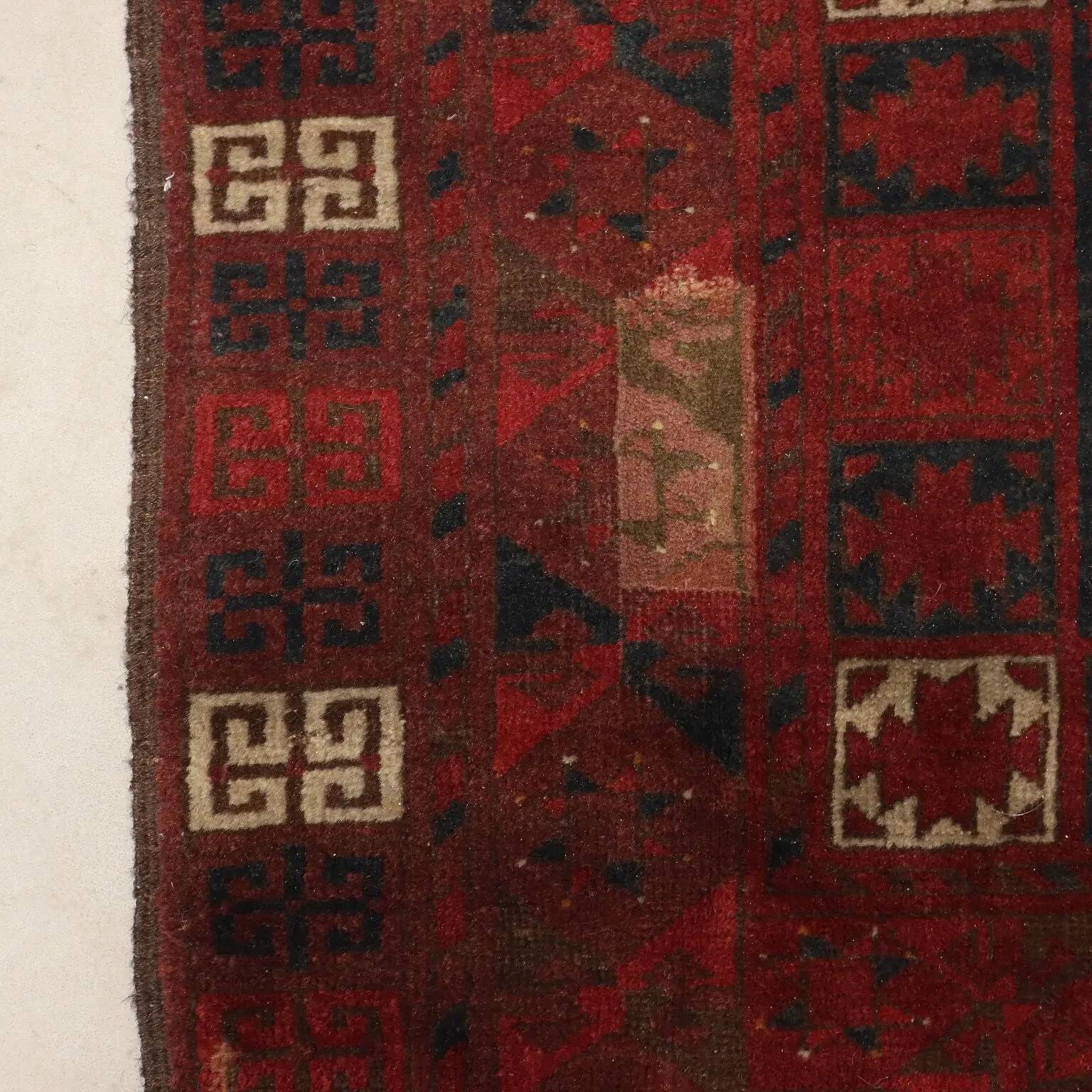 Ancient Asian wool rug, hand-knotted, 82 x 51 in.
