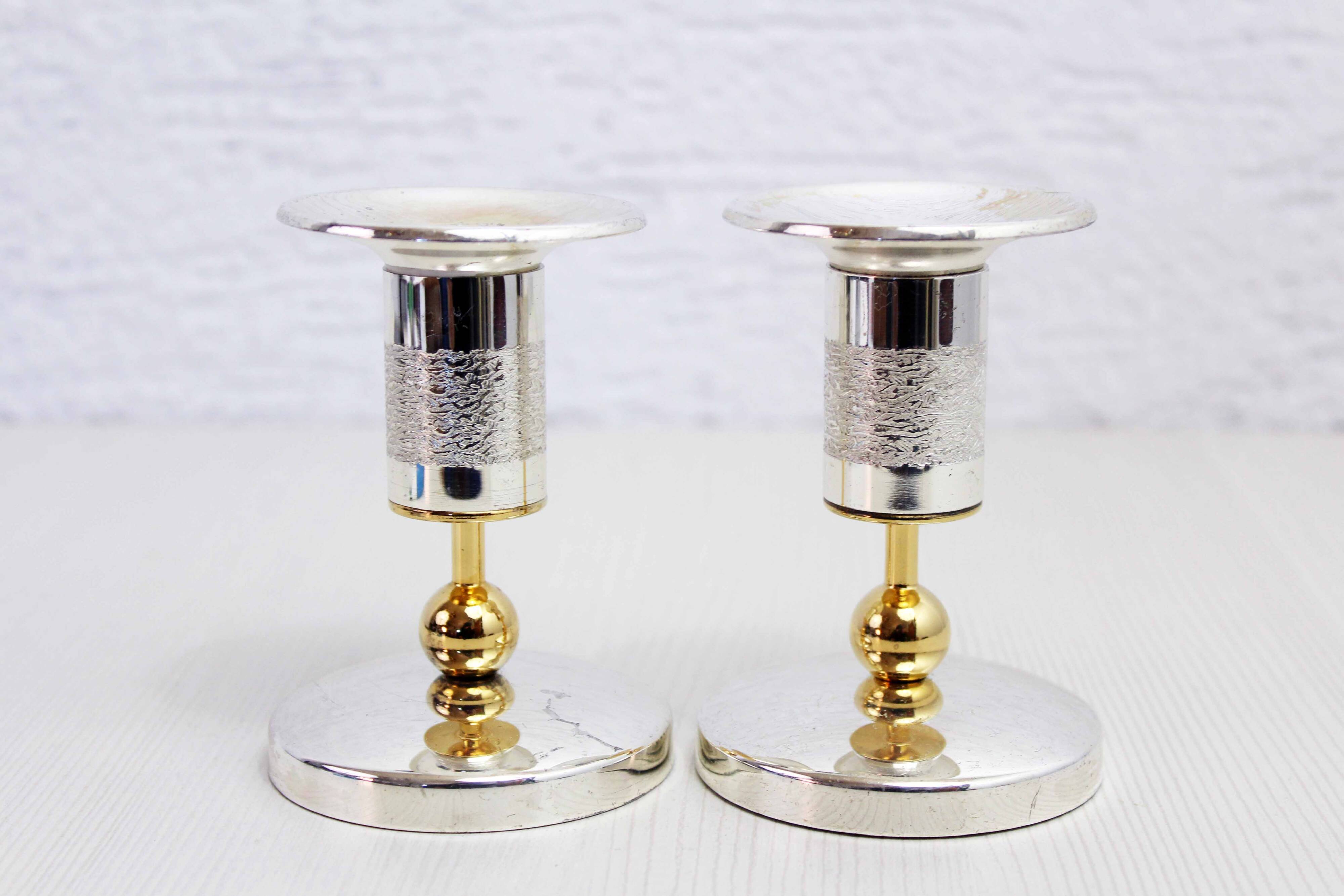 Pair of silver metal candlesticks