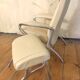 Beige leather armchair and footstool