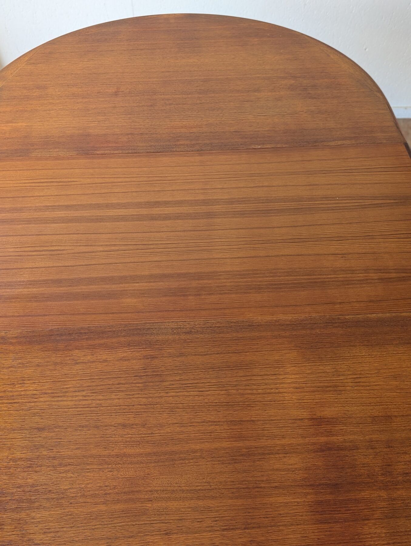 Scandinavian teak oval table from the 1960s, extendable up to 243 cm.