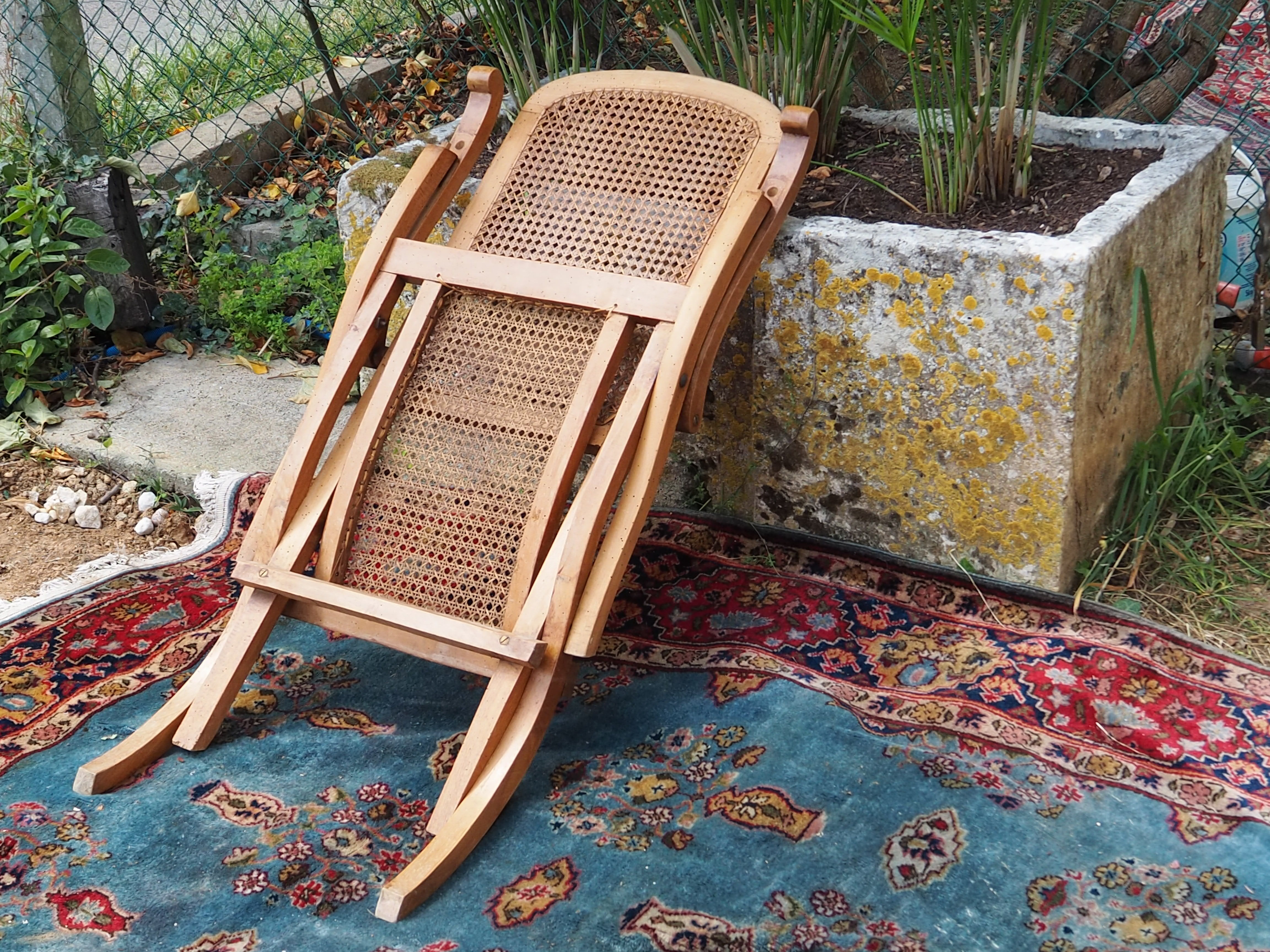 Cane folding armchair in solid wood