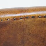 Fauteuil design en cuir de mouton vintage confortable avec un look robuste