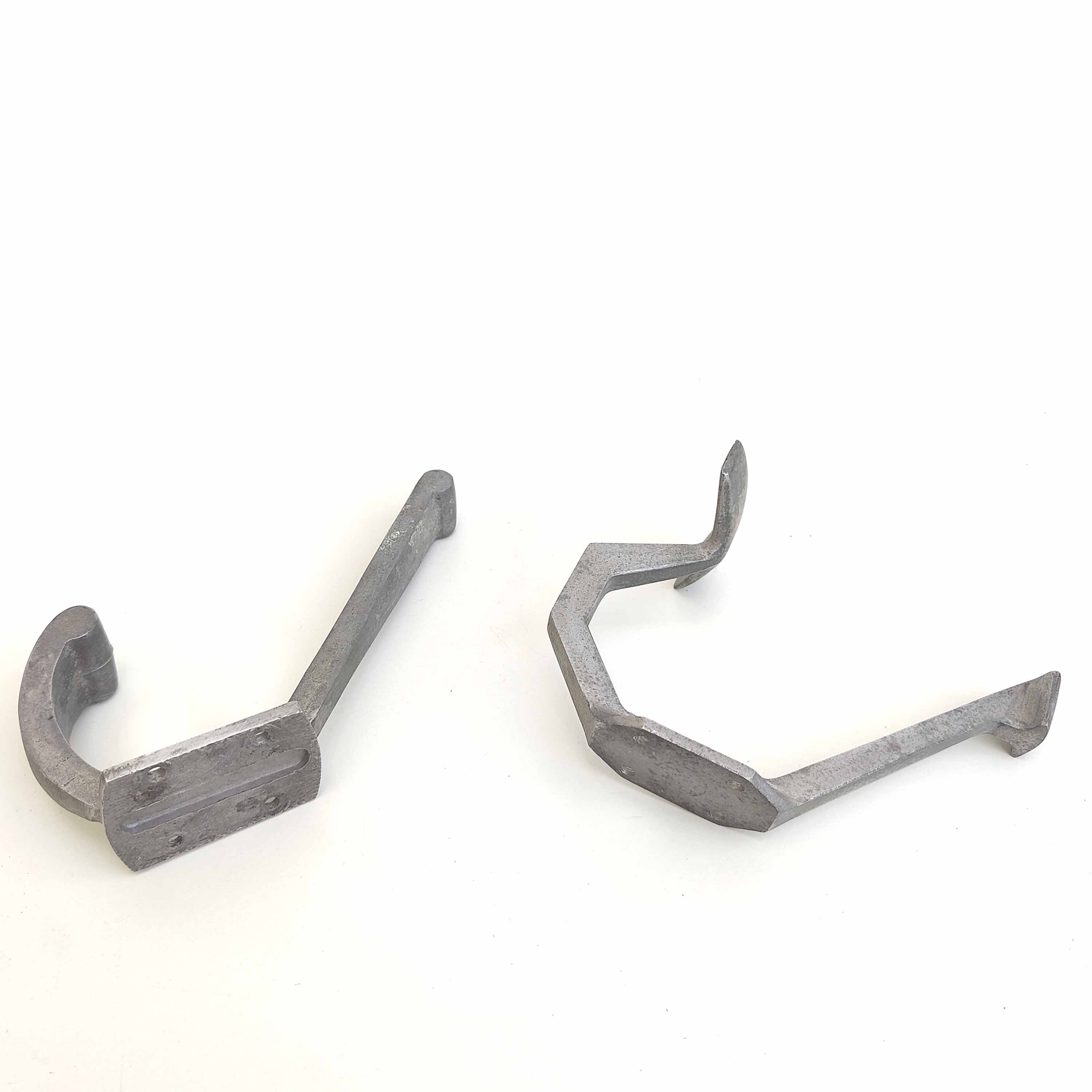 Two mismatched art deco aluminum hooks