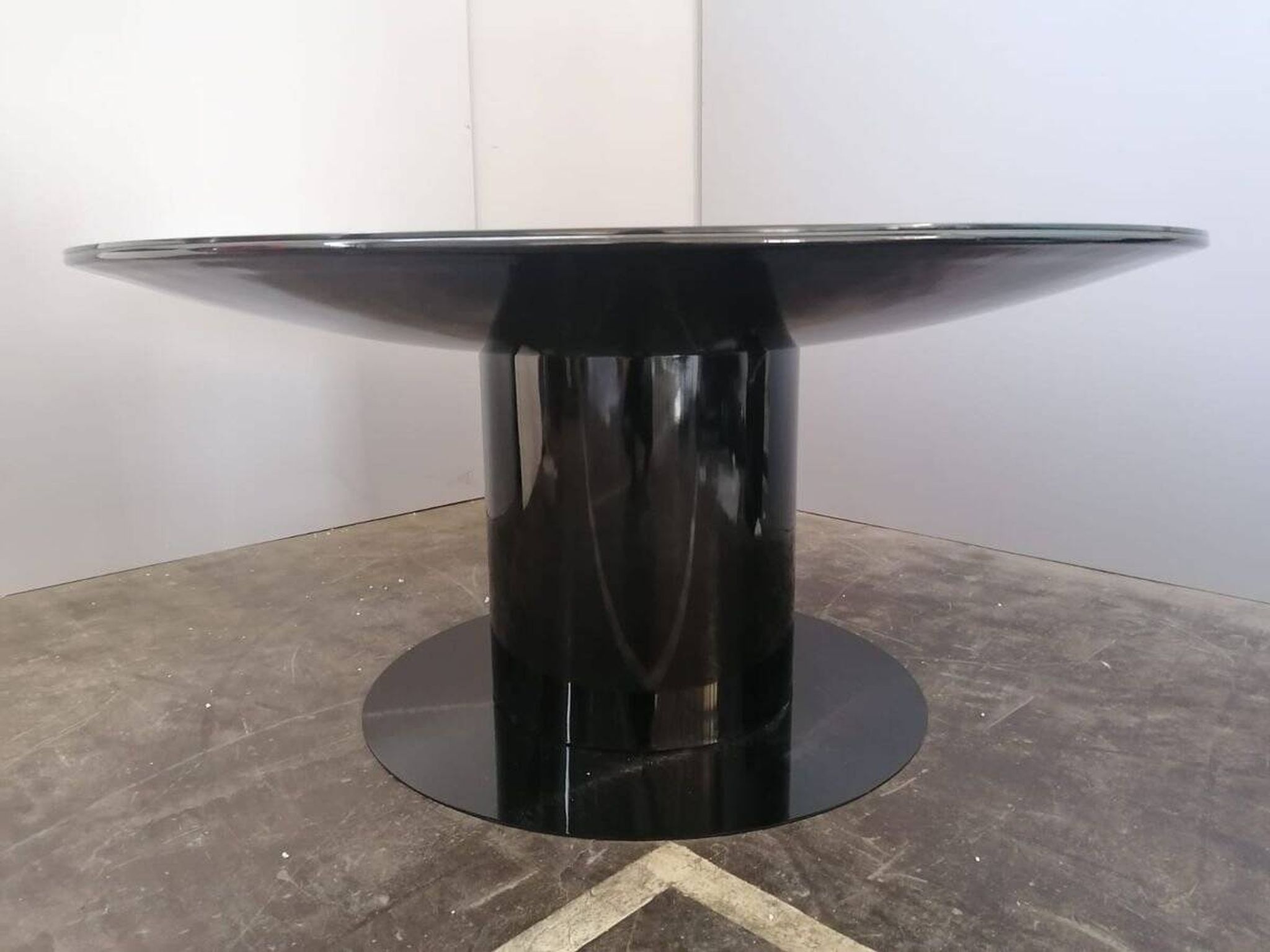 Black lacquered glass table and glass in the hoof style, Italy.