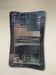 1950s double-thickness wall mirror with brass profile and supports.
