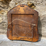 Old mirror carved in gray metal