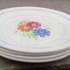 8 old flat plates decorated with flowers, Agnès model by K&G Lunéville