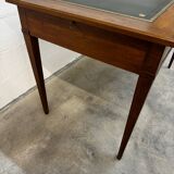 Louis XVI desk with green leather and shelves.