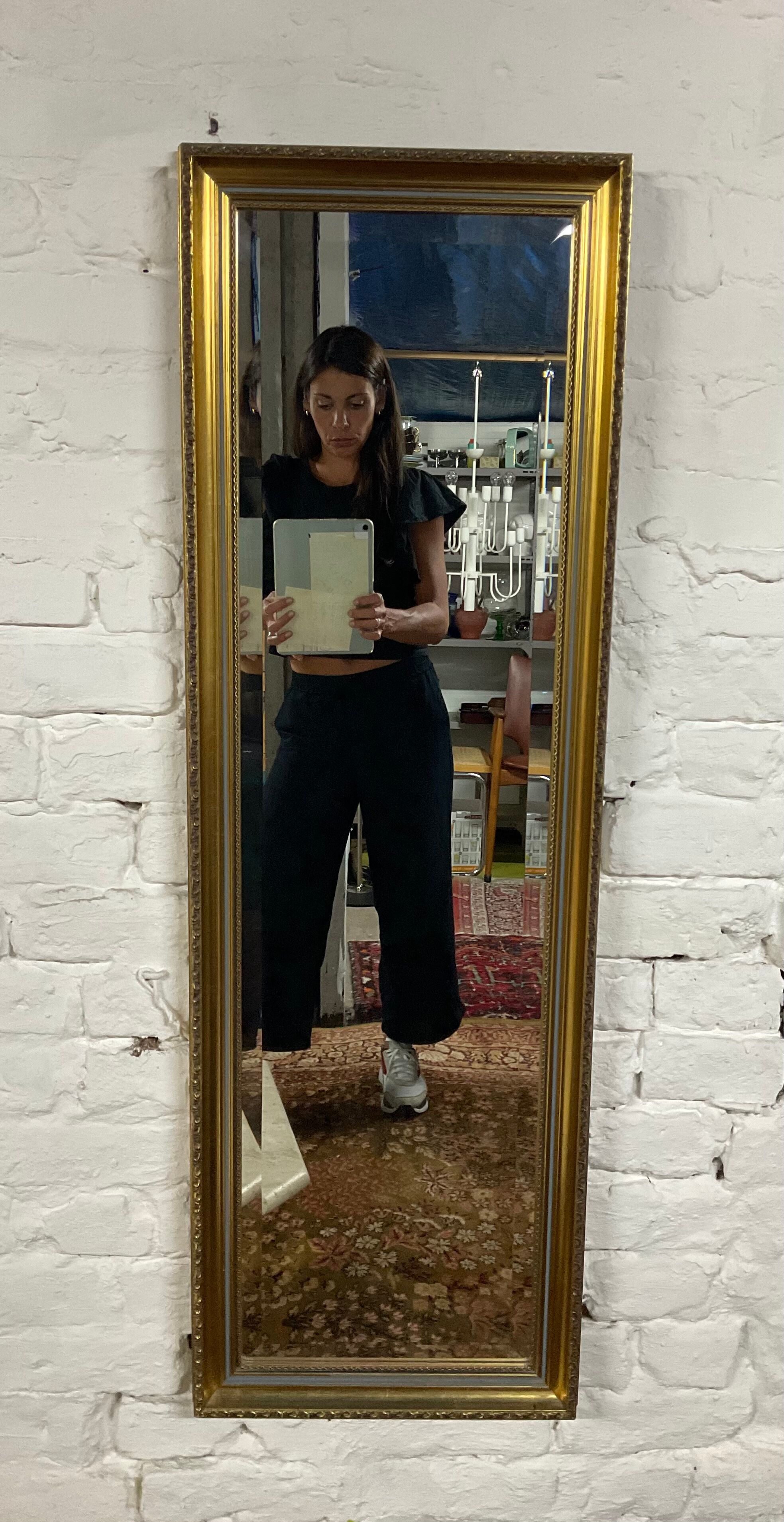 Vintage mirror in gilded wood and beveled glass