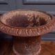 Pair of cast iron garden vases of Medici shape foot shower early twentieth century