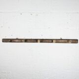 Handcrafted wall coat rack in raw wood