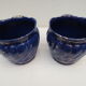 Pair of cache-old pots in midnight blue and gold ceramic