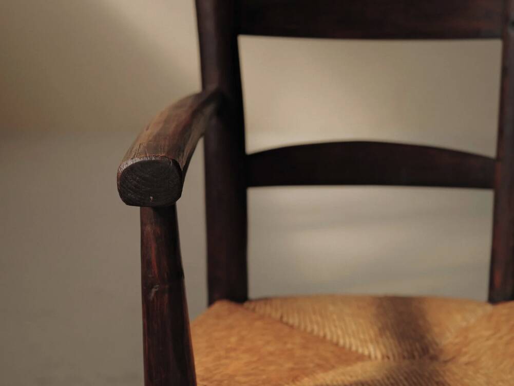 Pair of solid wood and straw armchairs, France, circa 1950.