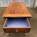Antique solid cherry farmhouse table with 2 end drawers and 1 pull-out.