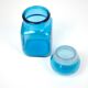 Bottle of pharmacy with screw lid in blue thick glass