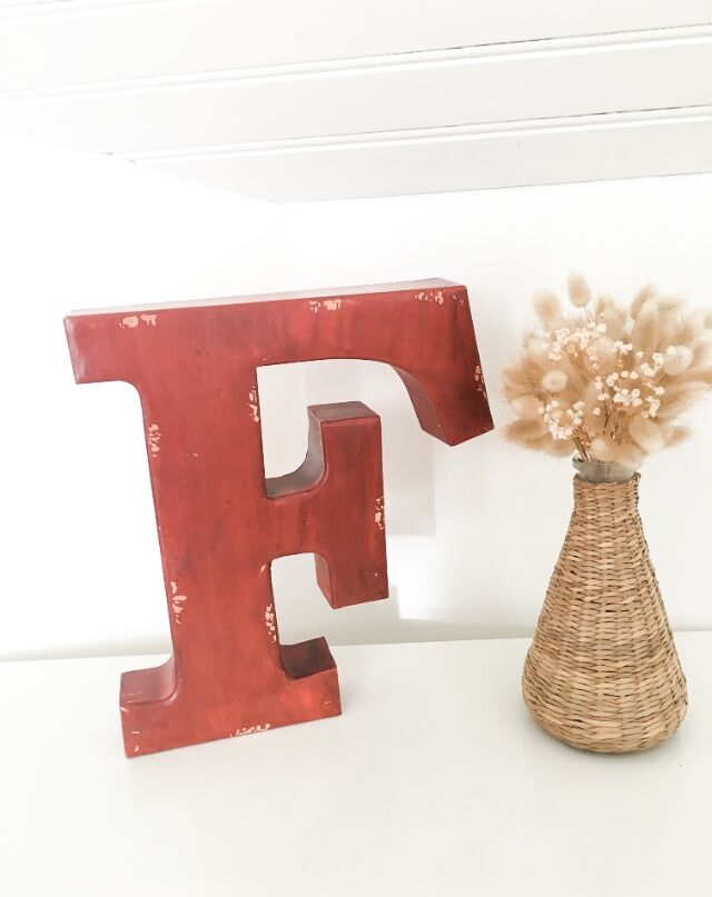 Red metal "F" sign letter