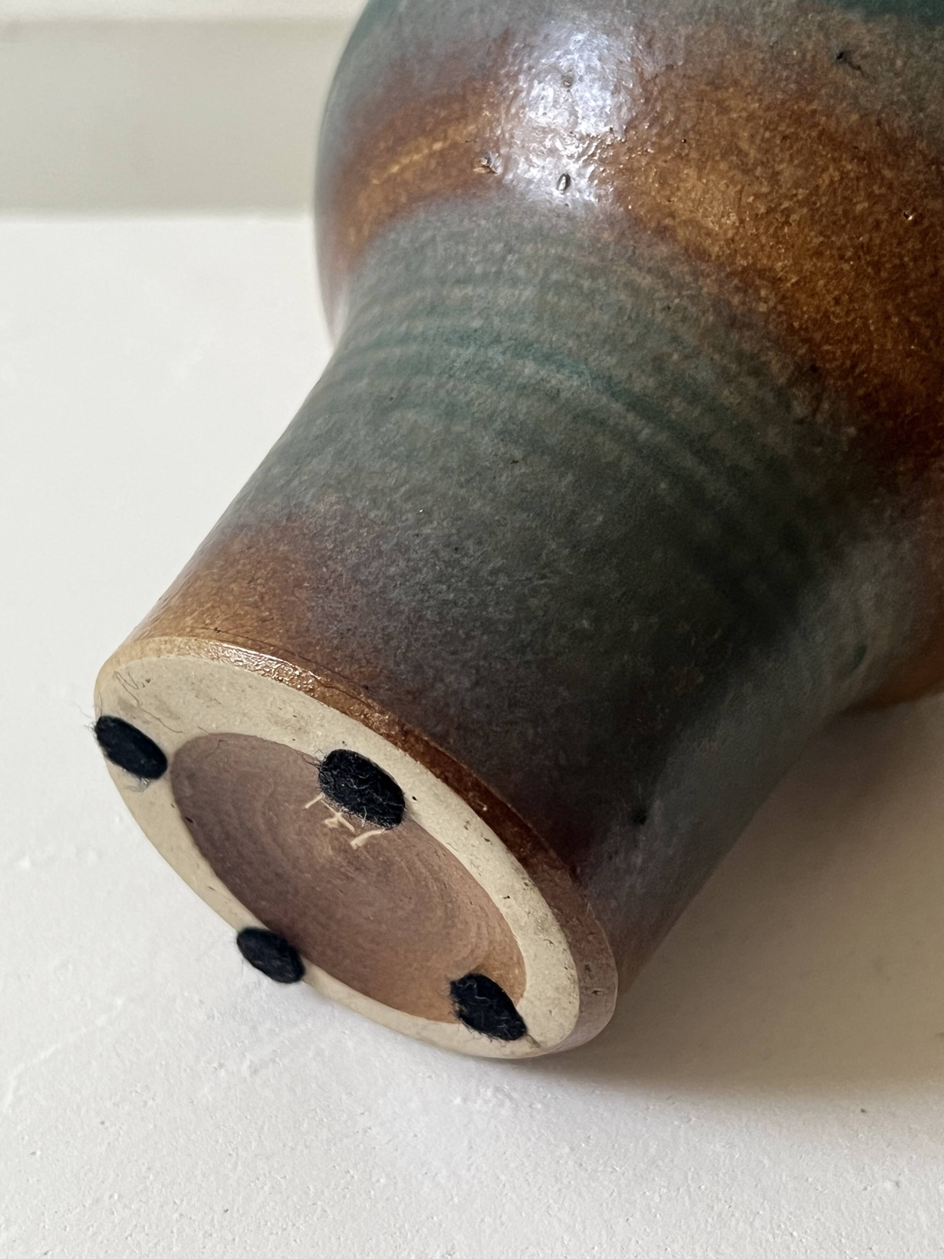 Brownish blue ceramic vase signed AH, France 1950.