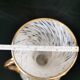 white and gold Clichy glass vase