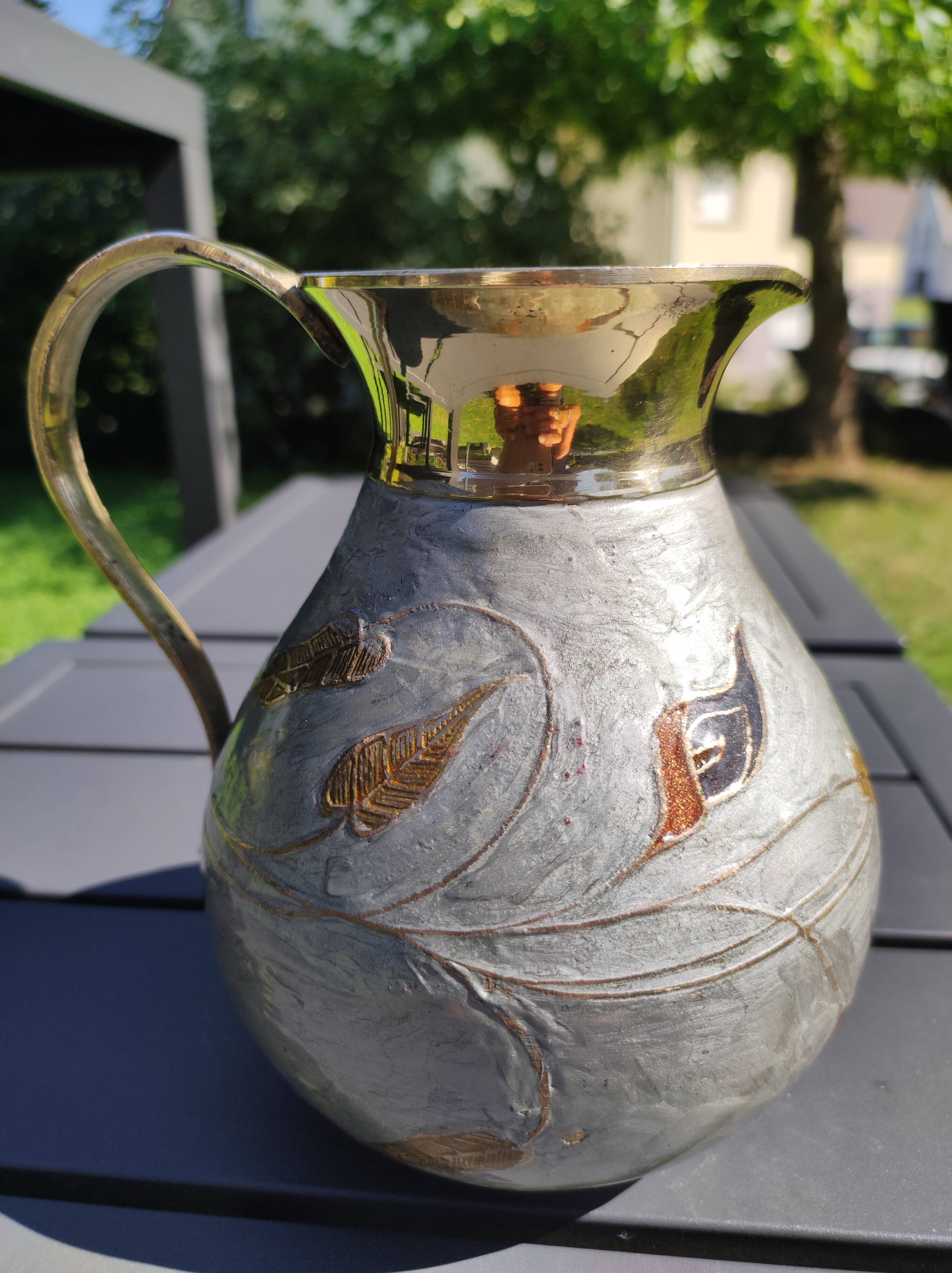 Decorative decanter in solid enamelled brass