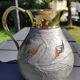Decorative decanter in solid enamelled brass