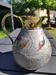 Decorative decanter in solid enamelled brass