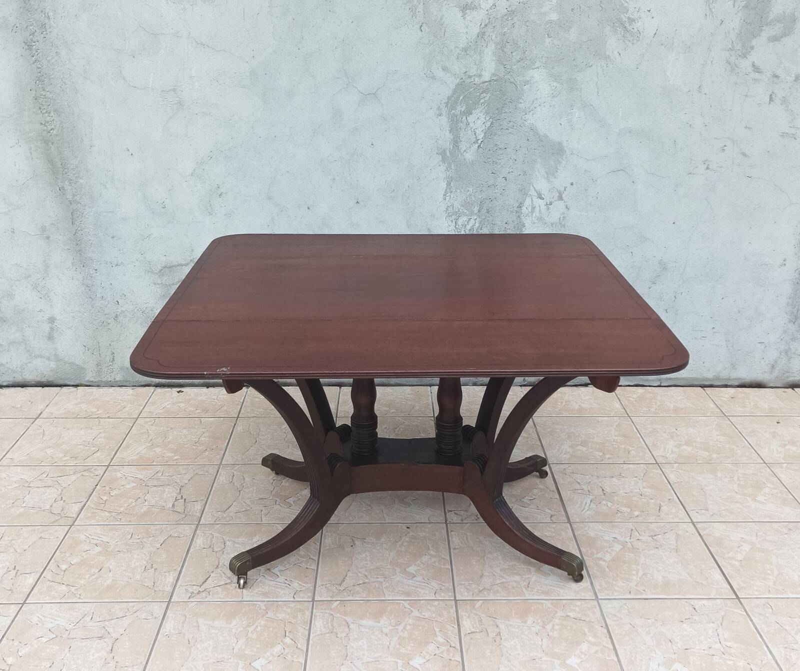 19th-century English style mahogany drop-leaf table.