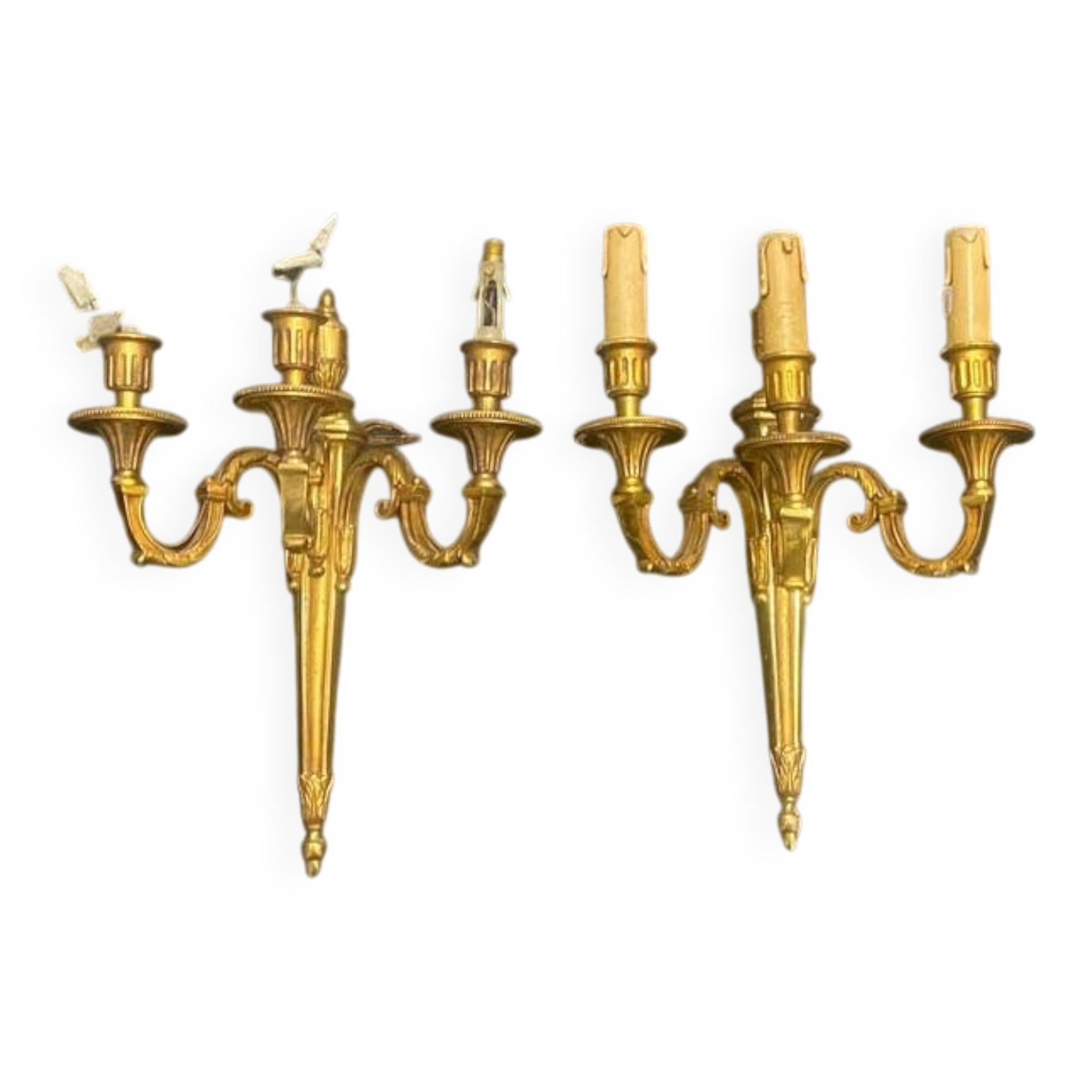 Pair of gilt bronze wall sconces with three lights in the Louis XVI style.