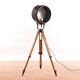 Old industrial spot on wooden tripod floor lamp